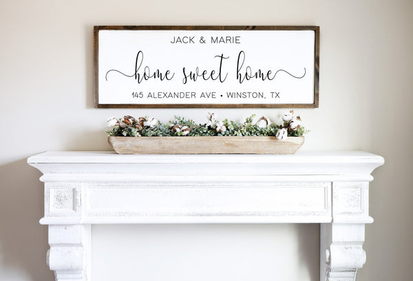 Personalized wooden framed sign or canvas gallery wrapped sign that features " Home Sweet Home " in the center with a script font. Couples Names at the top and address, city and state on the bottom in a uppercase regular type font.
