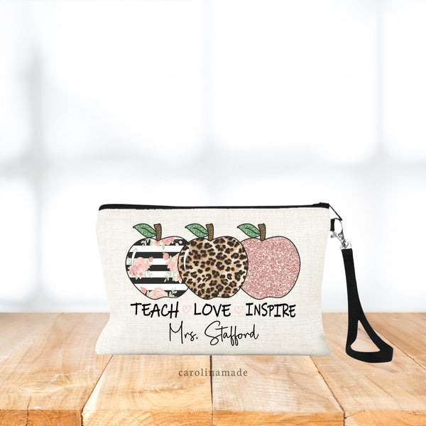 Teach Love Inspire - With three apples above the text. Pink Glitter Apple, Leopard Print Apple, white and black floral apple. Personalized with teacher name at the bottom.