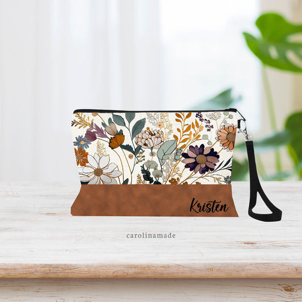 Boho Flowers on top with Faux leather on the bottom portion. Design is printed and not real leather. Linen cosmetic bag perfect as a purse or makeup bag. Personalize with your name!