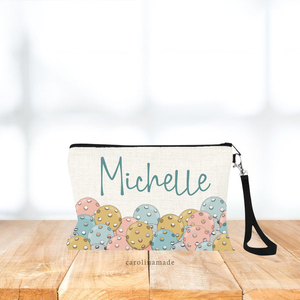 Pickleball linen bag with colorful balls along the bottom. Gold, Rose, Teal. Very Boho color Vibes. Personalized with your name.
