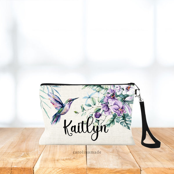 Beautiful watercolor hummingbird makeup bag. Features purple flowers, leaves and matching hummingbird. Personalized with your name on the bottom. Perfect gift for hummingbird lovers!
