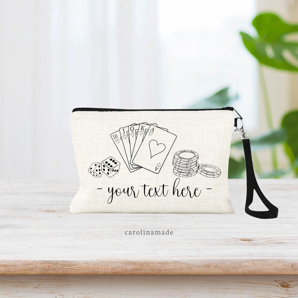 This linen wristlet bag features line art design of dice, playing cards and poker chips.  This bag allows you to do custom text under the design. You choose your wording!