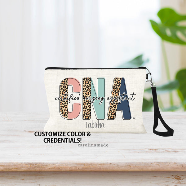 Monogram Linen wristlet. Credentials are in half leopard half color font in the background with title above it. Name is personalized under credentials. Example shows: CNA with certified nursing assistant title over top of it.
