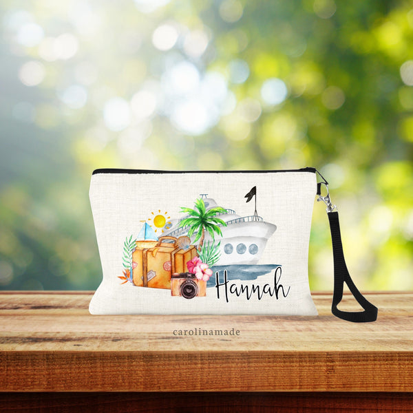 This linen wristlet features a watercolor design with cruise ship, water, suitcase, camera, sun, shells and other small art. Itis personalized with your name on the bottom right corner.