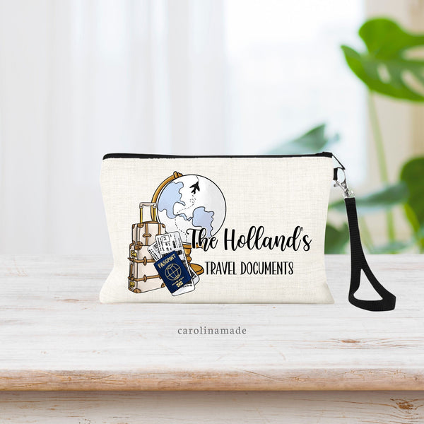 This linen wristlet zippered pouch features a globe, suitcases and passport and airline tickets clip art. The text says The (name)'s Travel Documents. Personalize for your family to hold your passport & other important documents.