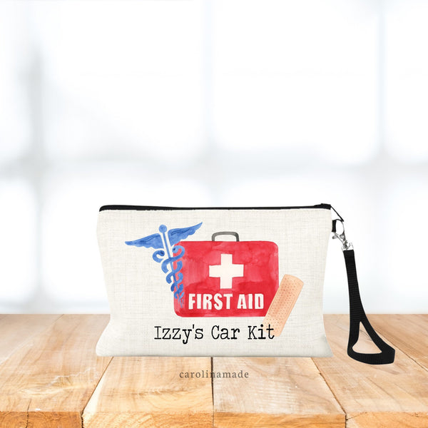 Linen Wristlet with first aid graphic on front. Personalized with your name.