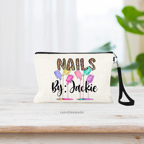 Linen wristlet says NAILS by: name. With finger nail polish spilled. Super cute and colorful bag for nail tech