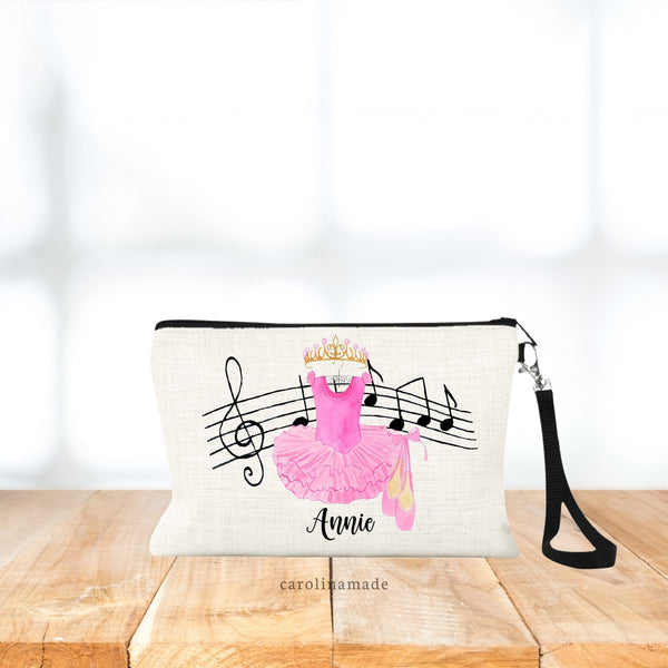 Linen wristlet features musical notes, leotard, ballet shoes and crown. Personalized with name on the bottom.