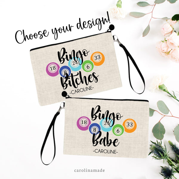 This linen wristlet features two design options. One says Bingo Bitches and the other says Bingo Babe with your name personalized under it. Between text is bingo balls with numbers on them.