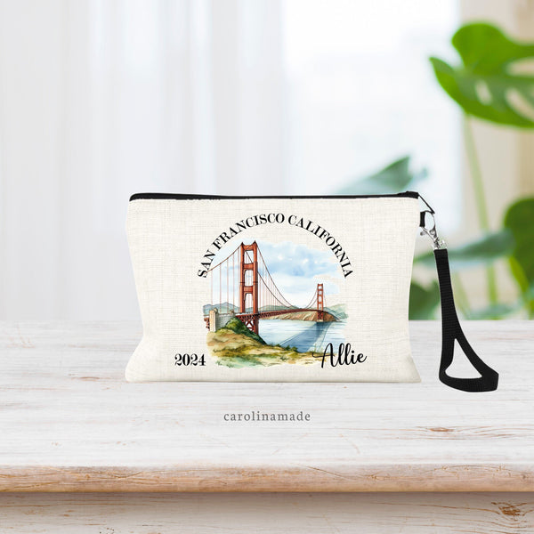 This linen bag shows a watercolor picture of the San Francisco bridge. Around it is the city & state. The bottom corner says the year and the right corner is personalized with your name.