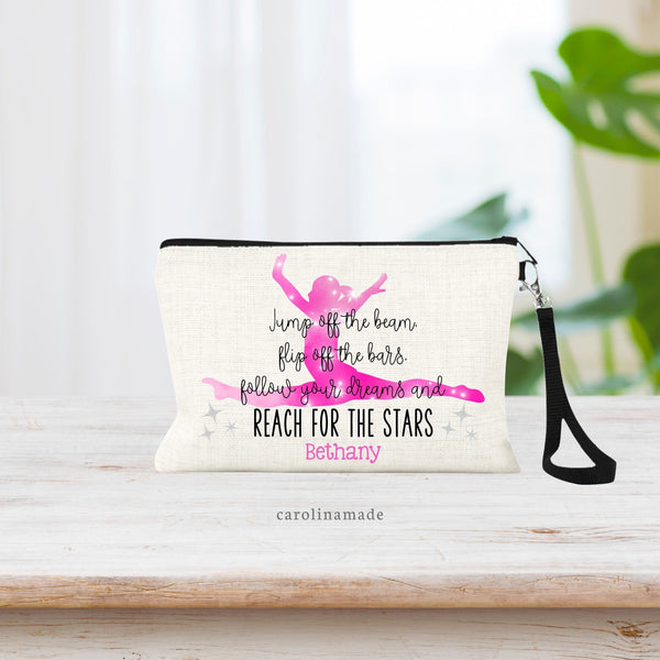 This bag features a pink gymnast flying through the air in the background with text over with. Name is personalized under the quote with printed glitter stars.