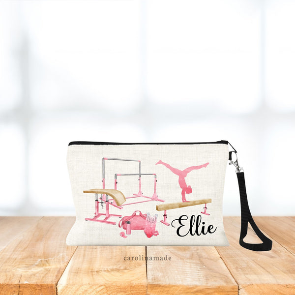 This linen wristlet features a gymnastics theme with vault, uneven bars, balance beam, gymnast doing a hand stand, and gymnastics gear - bag, water bottle, leotard, scrunchie and tape. Personalize with your gymnasts name at the bottom.