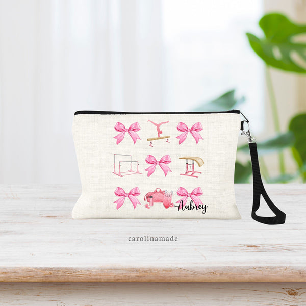 This linen wristlet features a pink bow preppy girl design for gymnasts! Coquette bow pattern with gymnastics elements - leotard, uneven bars, vault and balance beam. Personalized at the bottom with your gymnasts name.