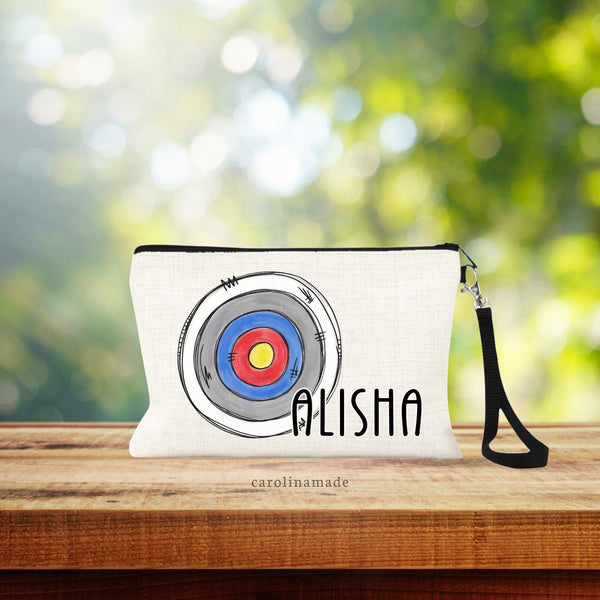 This linen pouch features a large archery target circle offset to the left with a name personalized next to it.