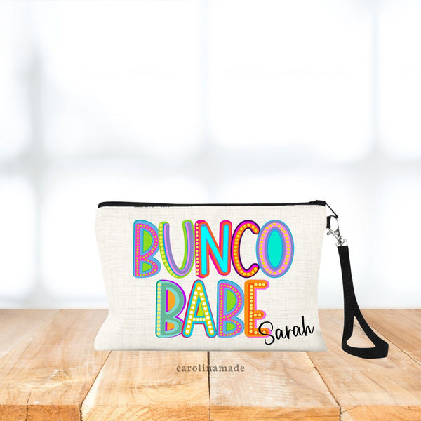 This linen zipper pouch says BUNCO BABE large across the bag in a colorful marquee style font. Your name is personalized in the bottom corner.