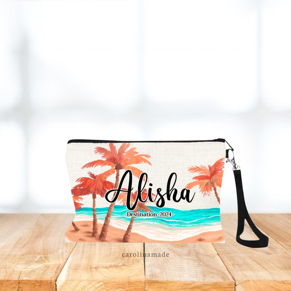 Beach theme zippered back shows sand, and water with palm trees that have orange leaves. Personalize the bag with a name in the center and optional line under the name to include destination, date, or whatever you would like.