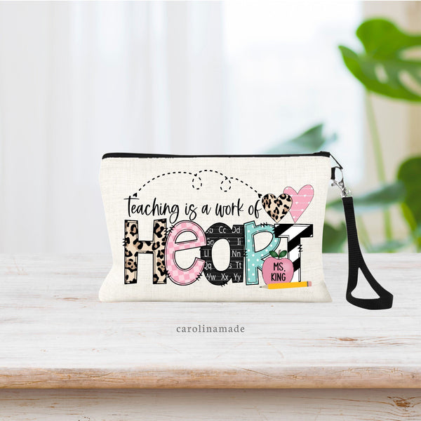 The perfect teacher appreciation gift! Teaching is a work of heart personalized linen zipper pouch. The teacher's name is personalized on the apple in the bottom right corner.