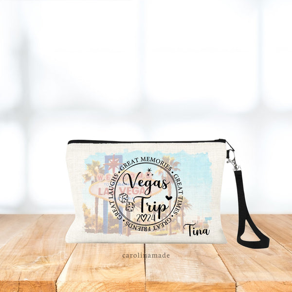 Dont forget your wristlet purse your next casino trip! This bag features a large circle in the center that says Vegas Trip, with sparkles, a heart, a pair of dice and the year. Personalize with your name. Picture of vegas strip in the background.