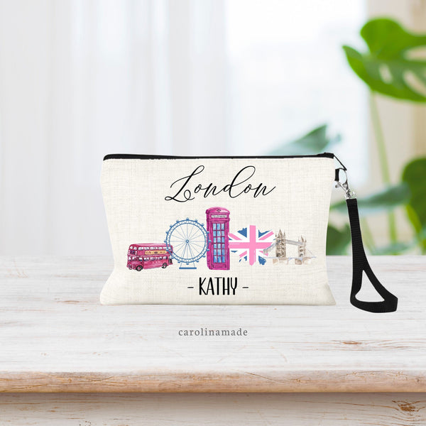 London Makeup Bag with bus, ferris wheel, phone booth, flag and bridge. Personalized at the bottom with your name.