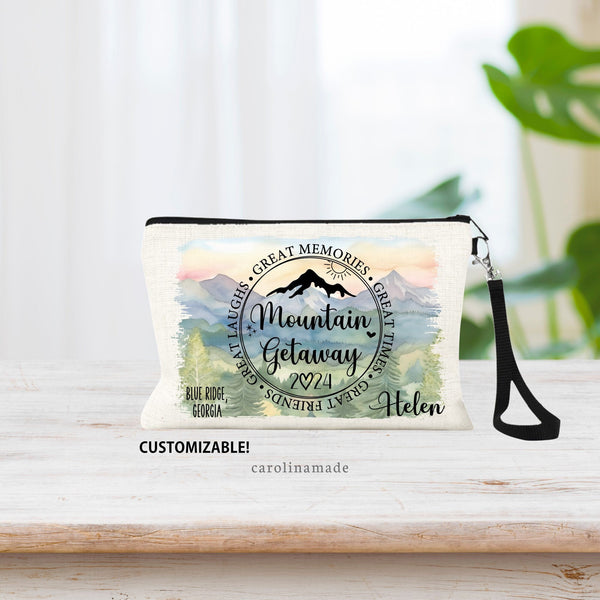 This linen zipper pouch features a circle that says: Mountain Getaway, with stars, mountain and sun. The year is noted at the bottom. Personalize with your name and destination. Background mountain scene options available.