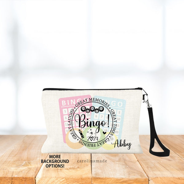 This linen wristlet features two bingo cards & bingo balls in the background. With a circle over top that says Bingo! Great Memories, great times, great friends, great laughs.  Personalize with your name!