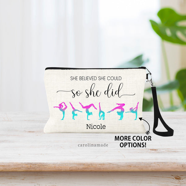 Gymnastics zipper pouch shows the quote: She believed she could so she did in a mixed font. With 6 gymnastics poses under the quote in your choice of color. At the bottom it is personalized with your gymnasts name.