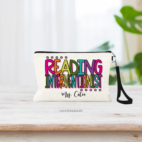 Reading Interventionist personalized zipper pouch with their name at the bottom. The text on this linen wristlet is made in bright colorful letters.