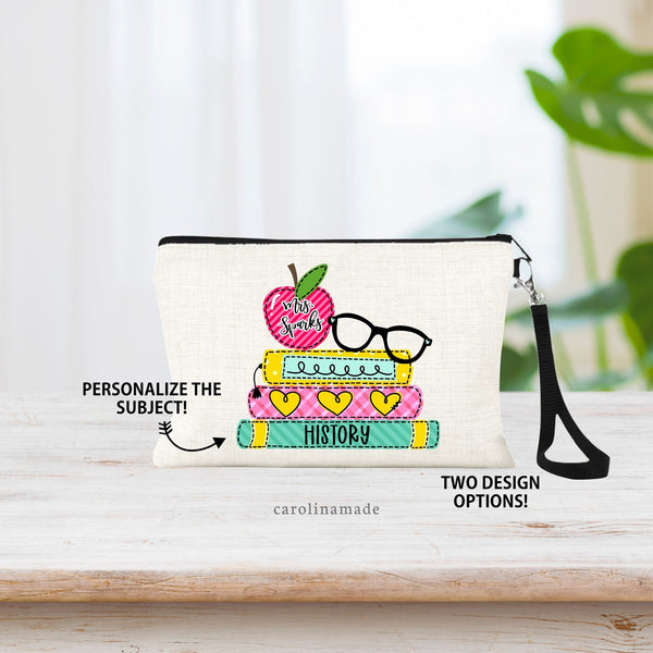 This linen wristlet features a colorful stack of books with an apple and glasses on top. The apple is personalized with your teachers name. And the bottom book says the subject they teach.