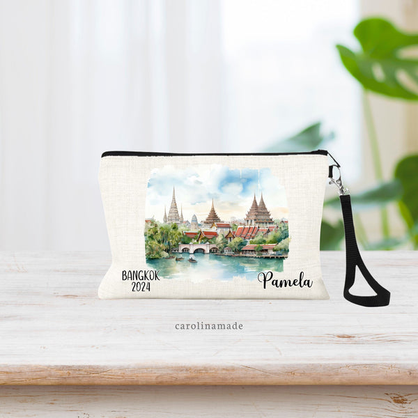 Beautiful watercolor design of Bangkok Thailand in the middle of this linen wristlet bag. It is personalized with your name on bottom right, with Bangkok and the year on the bottom left.