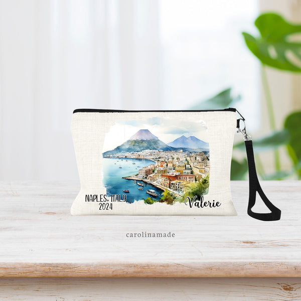 Beautiful watercolor design of Naples Italy in the middle of this linen wristlet bag showing the town, waterfront and volcanoes.  It is personalized with your name on bottom right, with Naples Italy and the year on the bottom left.