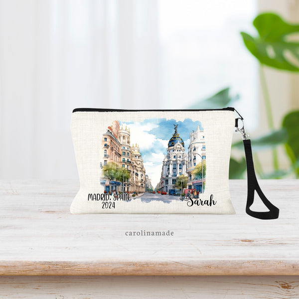 Watercolor Madrid Spain Downtown scenery in the center of the bag. The right corner is personalized with your name. The left corner says Madrid Spain and the current year.