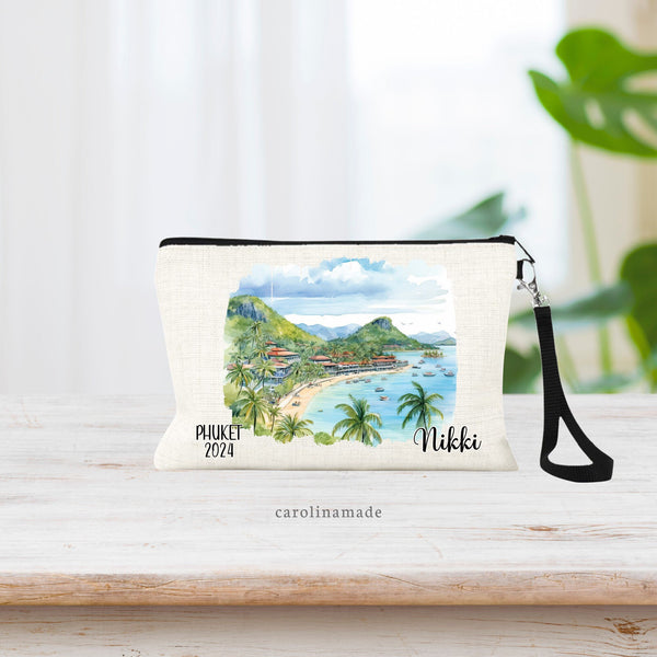 Watercolor Phuket Thailand Scene with volcano and ocean front in the center of the wristlet. The bottom says Phuket and the current year on the left. The right is personalized with your name.