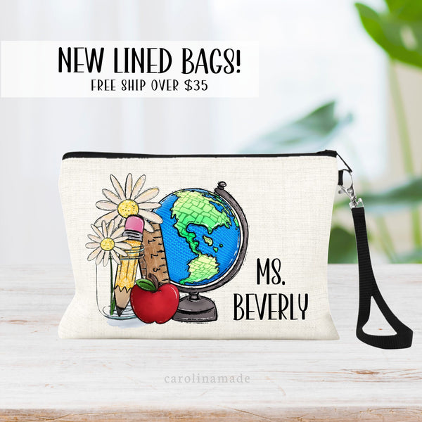 The perfect teacher appreciation gift! A globe, ruler, apple, flower and pencil is on the right. The teachers name is personalized next to the design on the right of the zipper pouch.