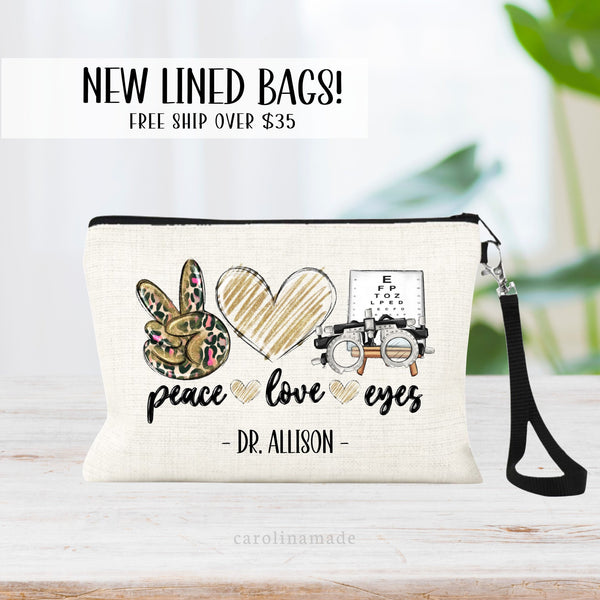 This bag features a design that says peace love eyes with a leopard print peace sign, gold glitter heart and and eye chart and glasses. Personalize with their name at the bottom.
