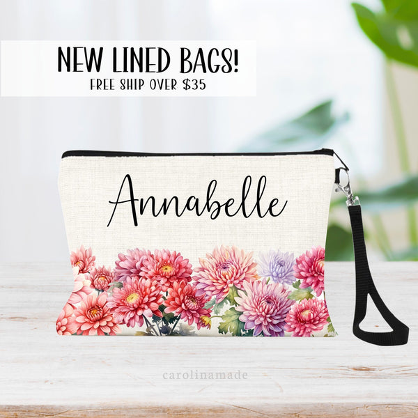 This zipper pouch features pink chrysanthemum flowers along the bottom border and is personalized at the top with your name. Perfect gift for November Birthdays!