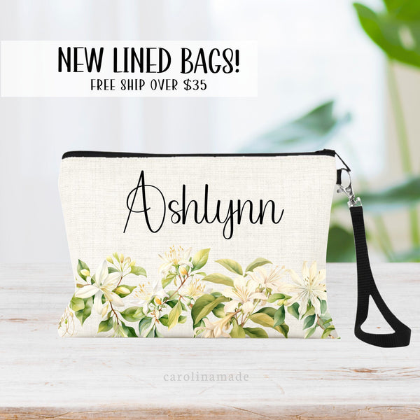 This zipper pouch features honeysuckle  flowers along the bottom border and is personalized at the top with your name. Perfect gift for June Birthdays!