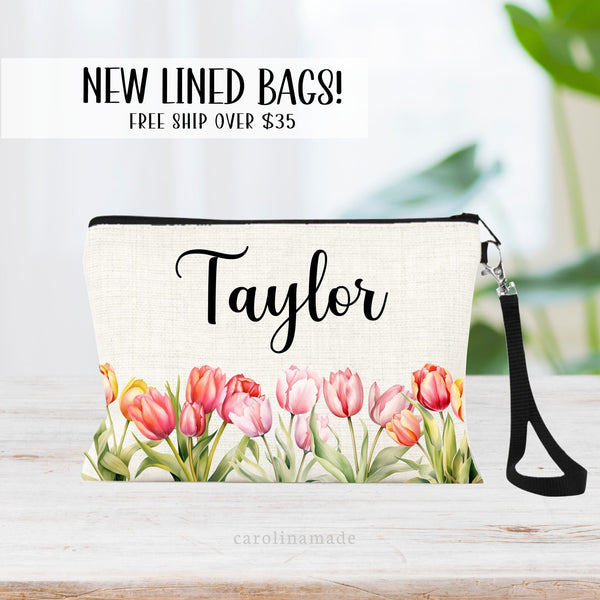 This zipper pouch features pink yellow orange tulip flowers along the bottom border and is personalized at the top with your name. Great gift idea for Mom!