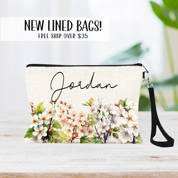 This zipper pouch features white hawthorn flowers along the bottom border and is personalized with your name at the top. Hawthorn is the birth flower for May and makes a great personalized gift!