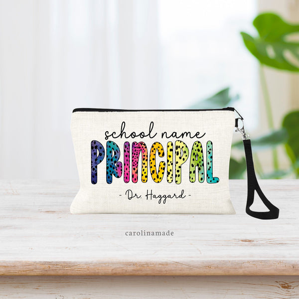 This linen zipper pouch has Principal in the center in bright colorful rainbow dalmatian pokadot design. It is personalized at the top with the school name. And the bottom is customized with their name.