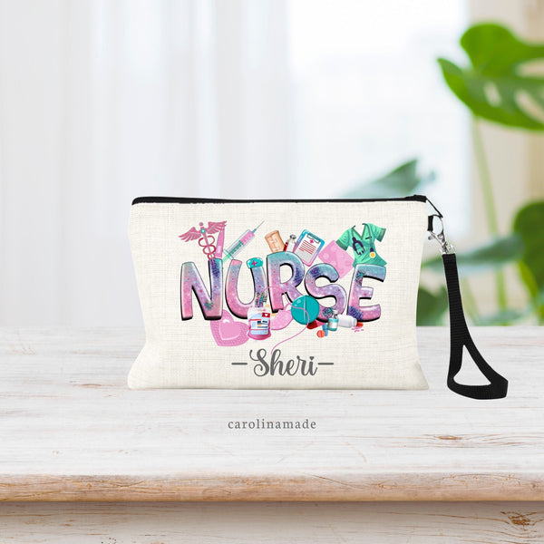 Nurse linen zipper pouch featuring NURSE in colorful pinks, purples and teal. With nursing art surrounding the word. Your name is personalized at the bottom in a dark gray script.