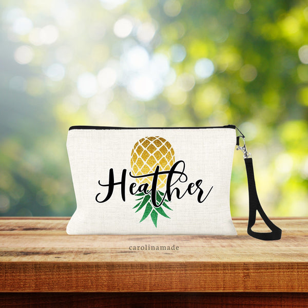 This lined zipper pouch is a unique pineapple makeup bag that is perfect as a swinger gift with an upside-down pineapple design in a printed glitter design. It is personalized with your name over top of it.