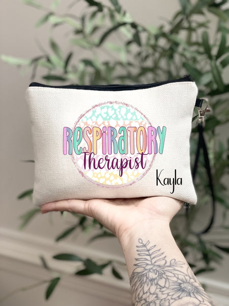 This linen zipper bag features a fun colorful rainbow design with the text Respiratory therapist in the center. The pouch is personalized in the bottom corner with your name.