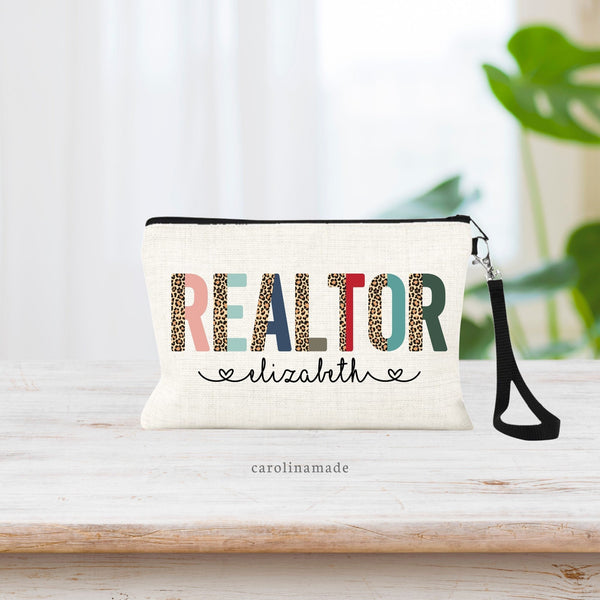 Linen wristlet bag with half color and half leopard print font that says REALTOR in large letters across the bag. Under it is personalized with your name.