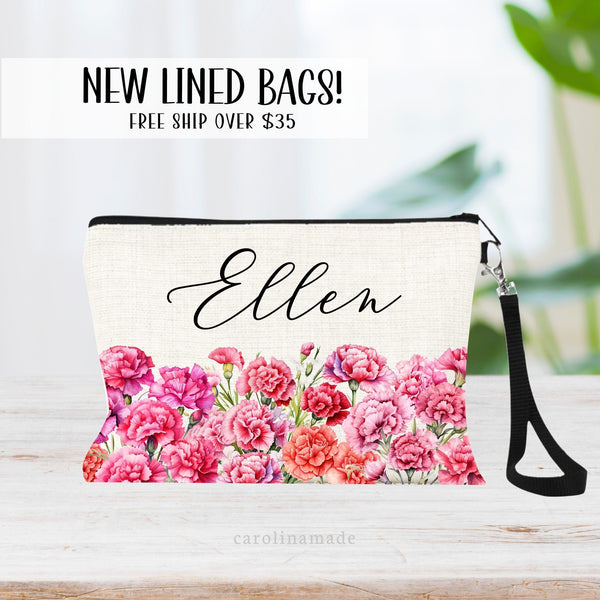 This zipper pouch features pink carnation flowers along the bottom border and is personalized at the top with your name. Perfect gift for January Birthdays!