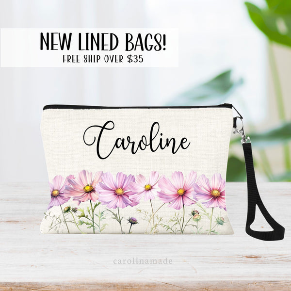 This zipper pouch features pink cosmo flowers along the bottom border and is personalized at the top with your name. Perfect gift for September Birthdays!