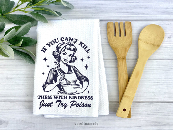 This white waffle weave towel features a retro woman stirring a bowl. And says If you can't kill them with kindness, just try poison.