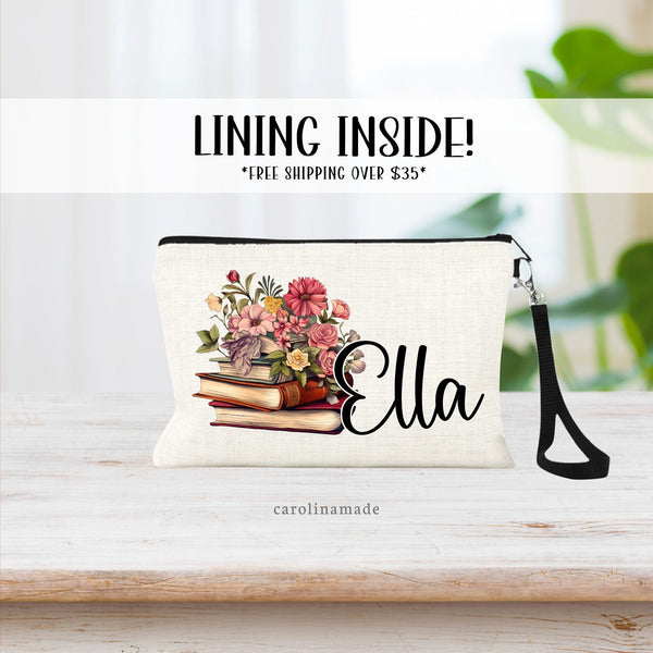 This linen zipper pouch features a stack of books with beautiful colorful flowers. it is personalized with a name next to the books.