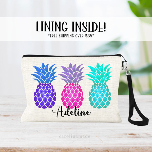 This linen makeup bag features colorful pineapples in a row and is personalized at the bottom with your name.