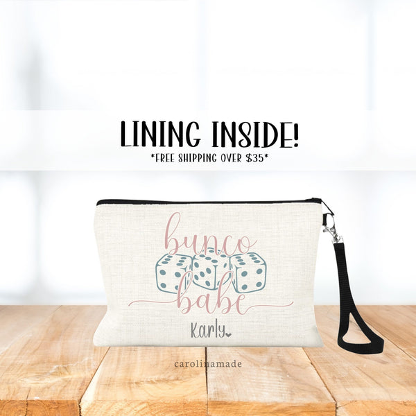This bag features three dice in the center with the text bunco babe. The bottom is personalized with your name. Colors can be changed.