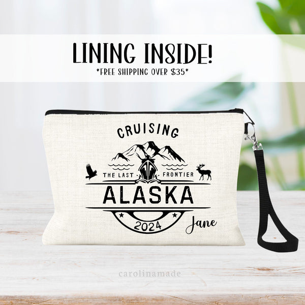 This linen wristlet is the perfect travel accessory for your next Alaska Cruise! The top says Cruisin with mountains, moose, eagle, and cruise Ship. Bottom says Alaska and the current year. And your name is personalized on the bottom corner.